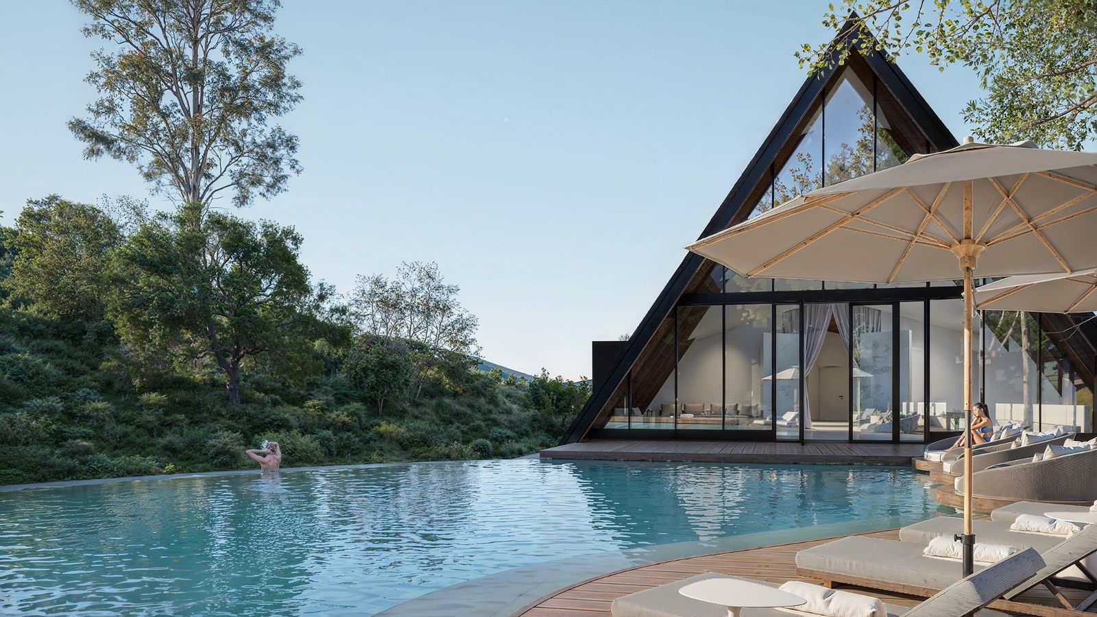 HUMANTA infinity pool and spa with A-frame backdrop